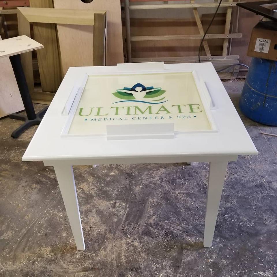 Ultimate Medical Center and Spa custom-branded indoor domino table